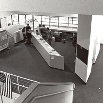 A black and white photo of the reception area of the athletic facility