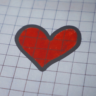 Drawing of a red heart on graph paper