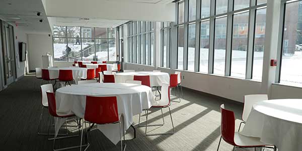 A photo of the Maria Hall multipurpose room with tables set out for an event