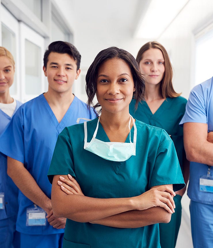Portrait Of Multi-Cultural Medical Team Standing In Hospital Corridor; Shutterstock ID 1637163589; purchase_order: -; job: -; client: -; other: -