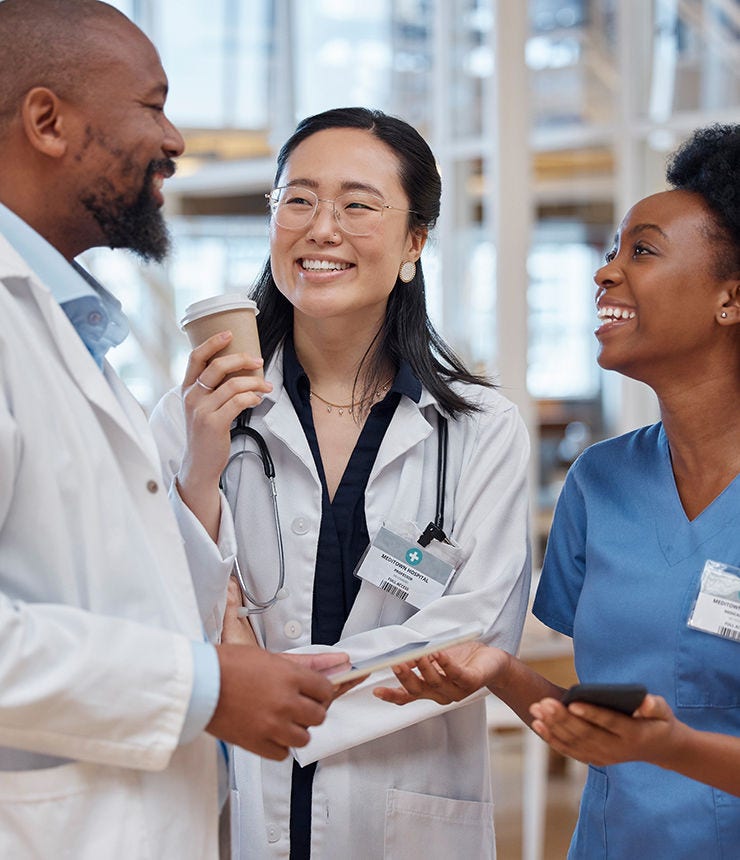 Women, black man and doctors in a meeting, planning and discussion with happiness, hospital and teamwork. Male person, staff and medical professional with conversation, healthcare and collaboration; Shutterstock ID 2327819001; purchase_order: -; job: -; client: -; other: -