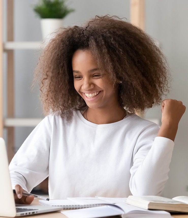 Excited happy overjoyed african american teen school girl student winner celebrating victory reading admission email with good exam test results received great news online looking at laptop computer.; Shutterstock ID 1653226621; purchase_order: -; job: -; client: -; other: -