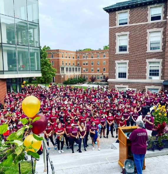 The Regis Community gathers in front of the Lorraine Tegan Learning Commons at the start of the annual Founders Day event