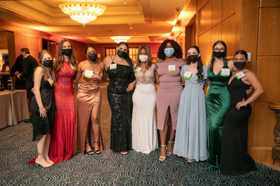 Regis students pose in evening wear during the 2021 Let It Shine Gala