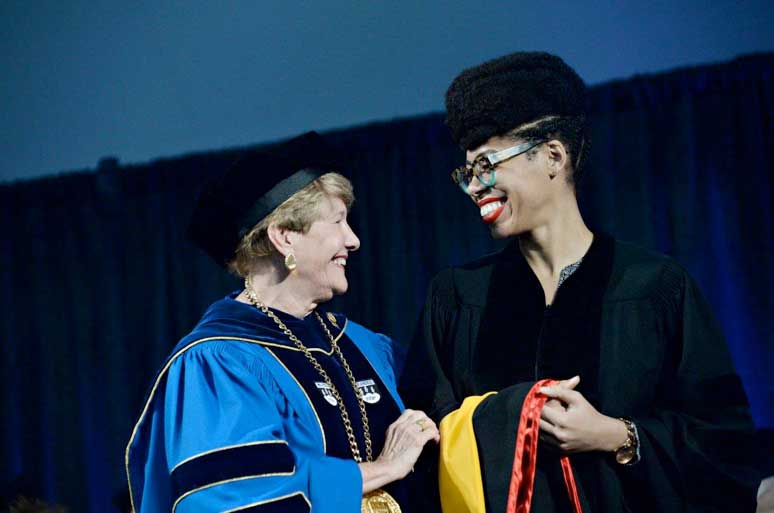 Dr. Ford receives her honorary doctorate from President Hays.