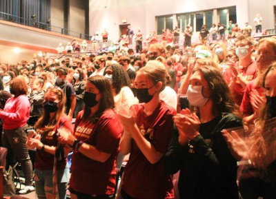 Students applaud at Regis College's 2021 Convocation