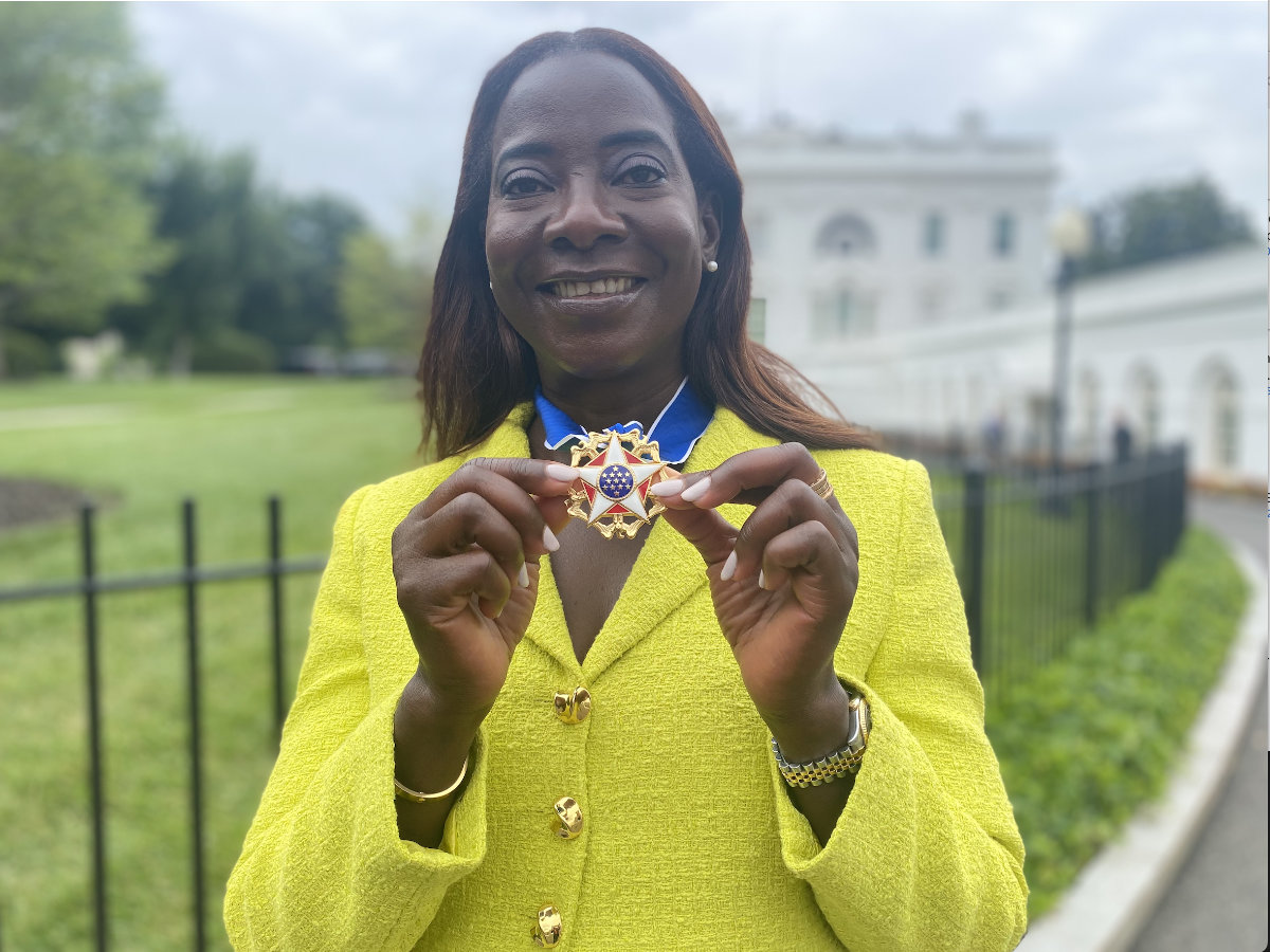 Sandra Lindsay poses with her 2022 Presidential Medal of Freedom