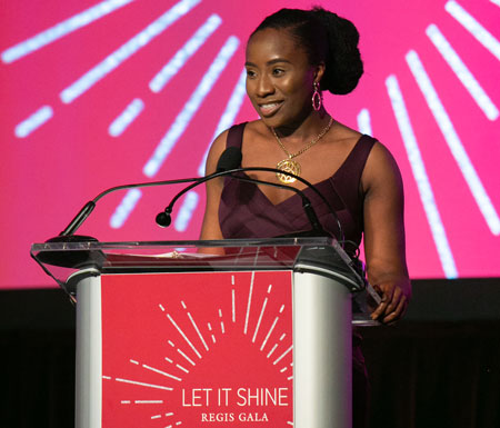 Ikhianosen Ukhuedoba ’19 speaking at the podium during the 2019 Let It Shine Gala