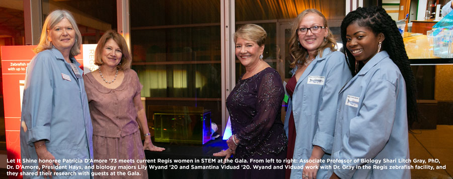 Let It Shine honoree Patricia D’Amore ’73 meets current Regis women in STEM at the Gala. From left to right: Associate Professor of Biology Shari Litch Gray, PhD, Dr. D’Amore, President Hays, and biology majors Lily Wyand ’20 and Samantina Viduad ’20. Wyand and Viduad work with Dr. Gray in the Regis zebrafish facility, and they shared their research with guests at the Gala.