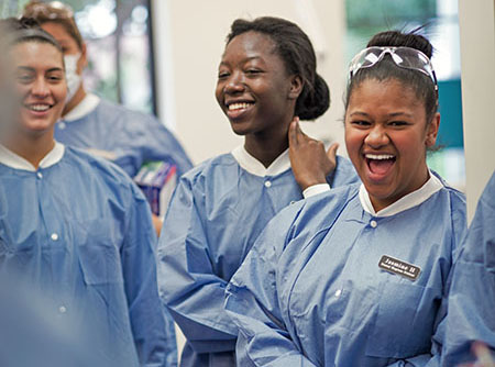 A group of Regis Dental Hygiene students laughing