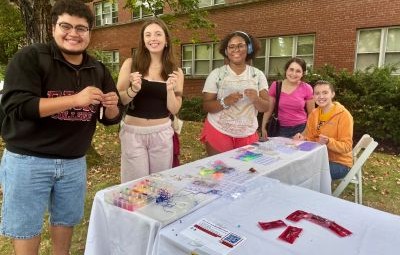 Students Making Bracelets at Fresh Check Day