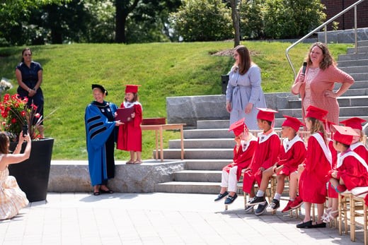 President Hays with children at the Children's Center graduation ceremony in June