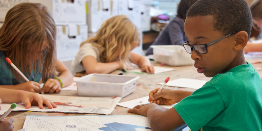 two young children in a classroom
