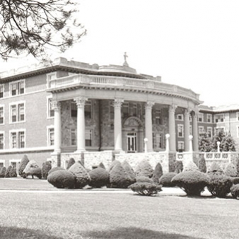 A black and white photo of the entrance of College Hall