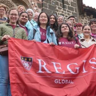 Regis College students stand outside the St. Michel d’Aiguilhe chapel in Le Puy 