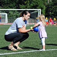 Regis College Children Center student on field