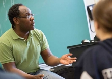 Regis College professor in classroom